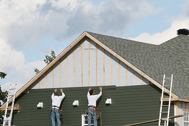 Professional Siding Contractor technician working in Baldwin, NY